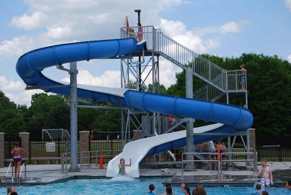4-H'ers sliding down the water slide at the pool